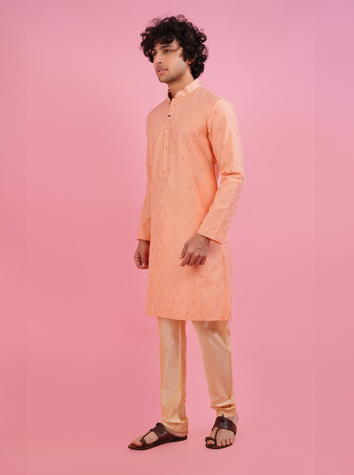 Stylish coral peach silk jacquard kurta pajama set for men, ideal for cultural celebrations.