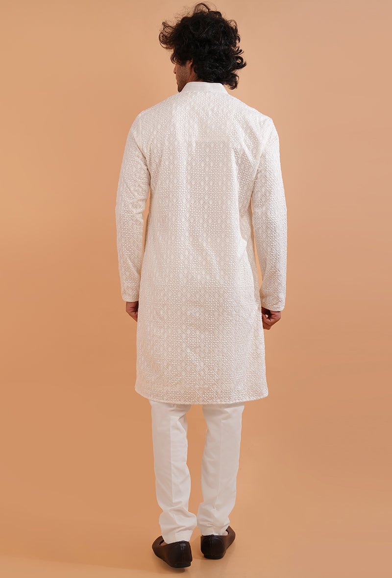 Premium white silk blend kurta pajama for men, featuring detailed embroidery for special occasions.