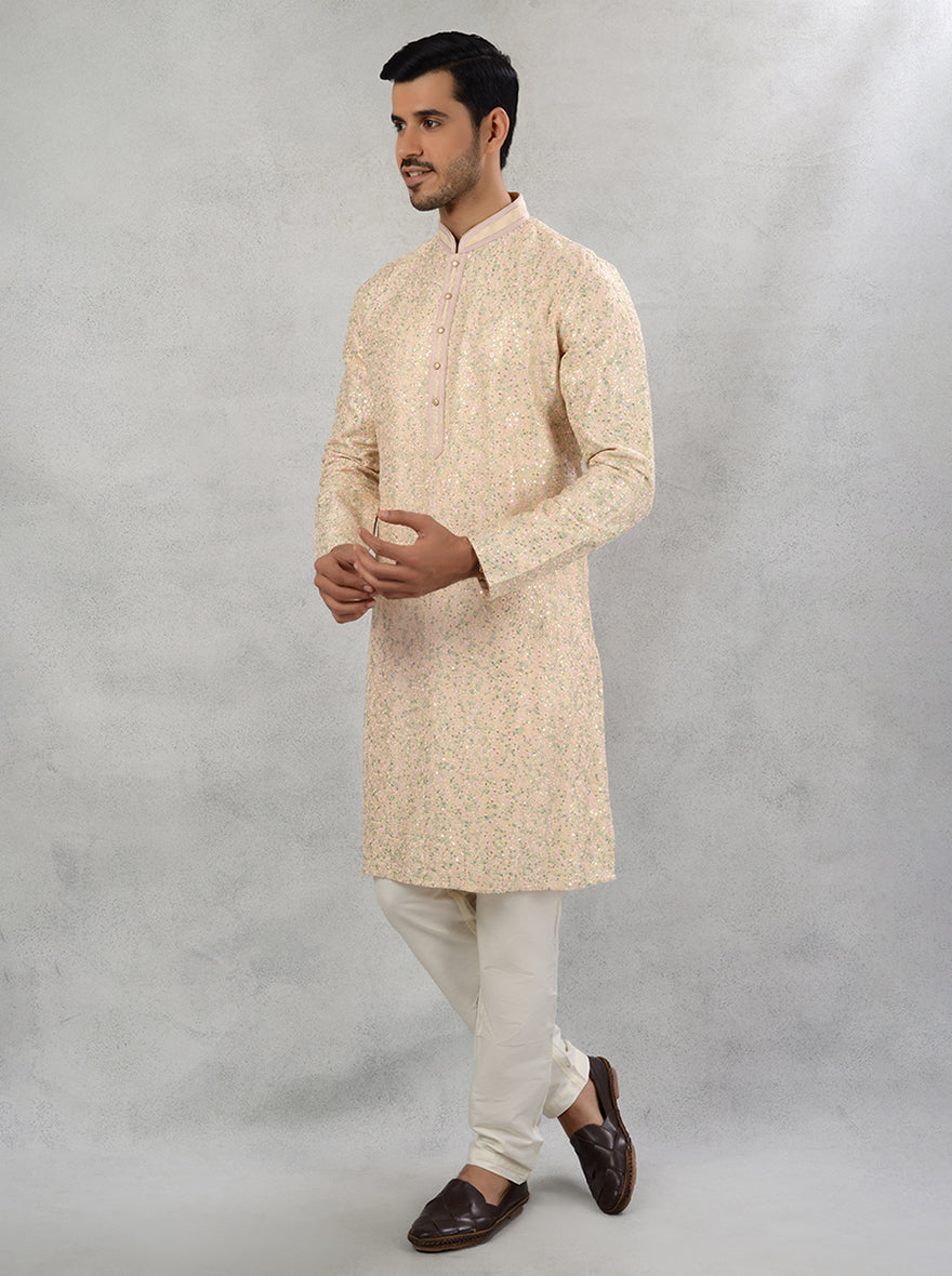 Classic straight cut peach silk kurta pajama with thread work and sequins.