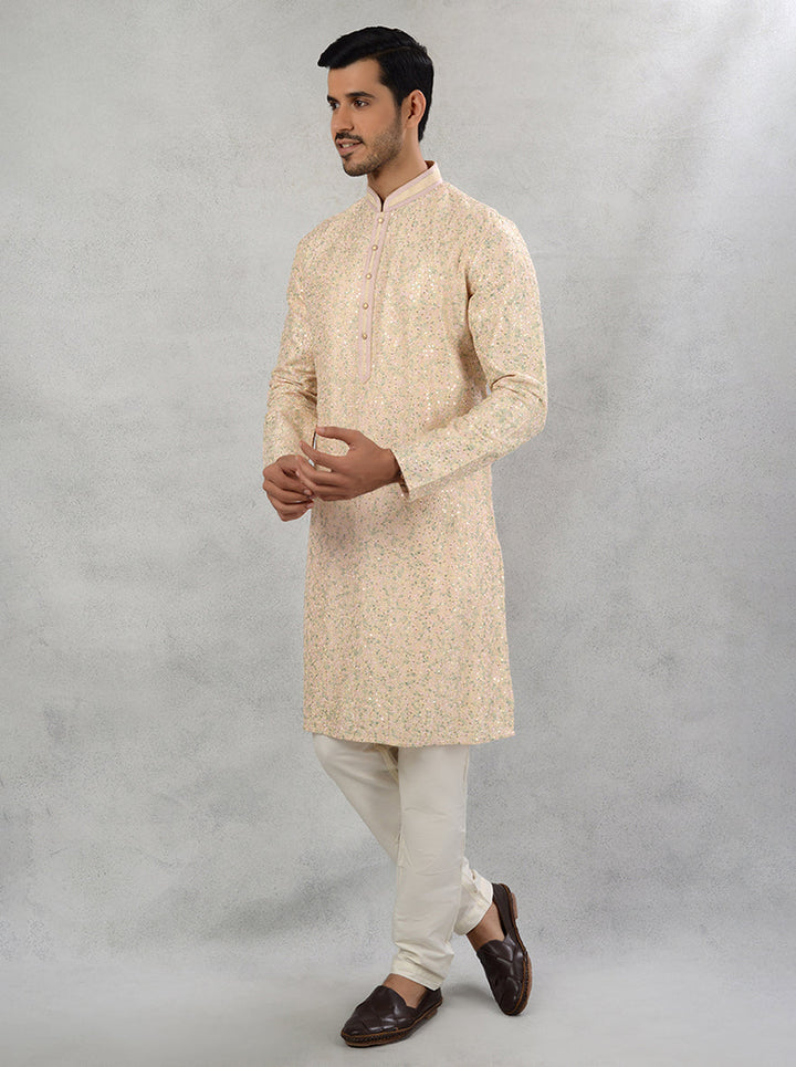 Classic straight cut peach silk kurta pajama with thread work and sequins.