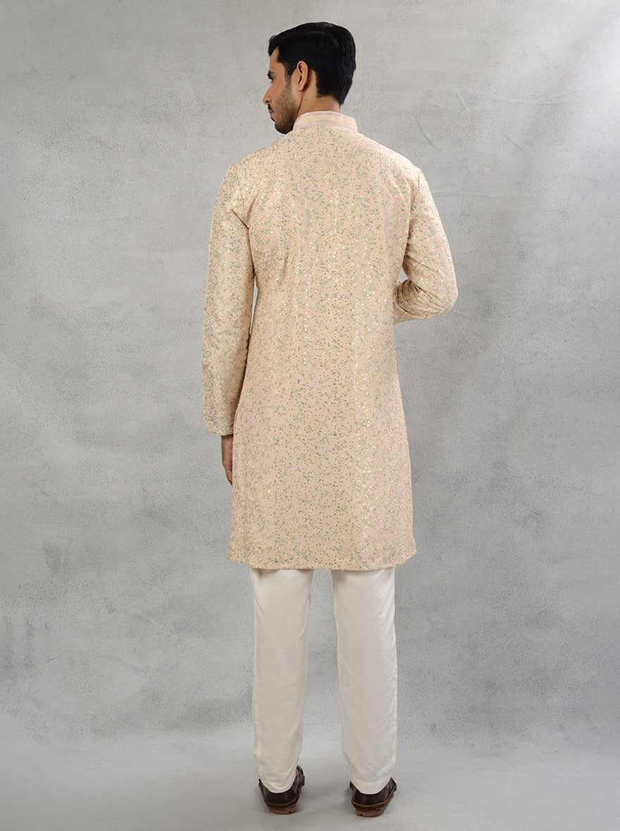 Men's peach silk blend kurta pajama with elegant Resham embroidery for Muhurat.