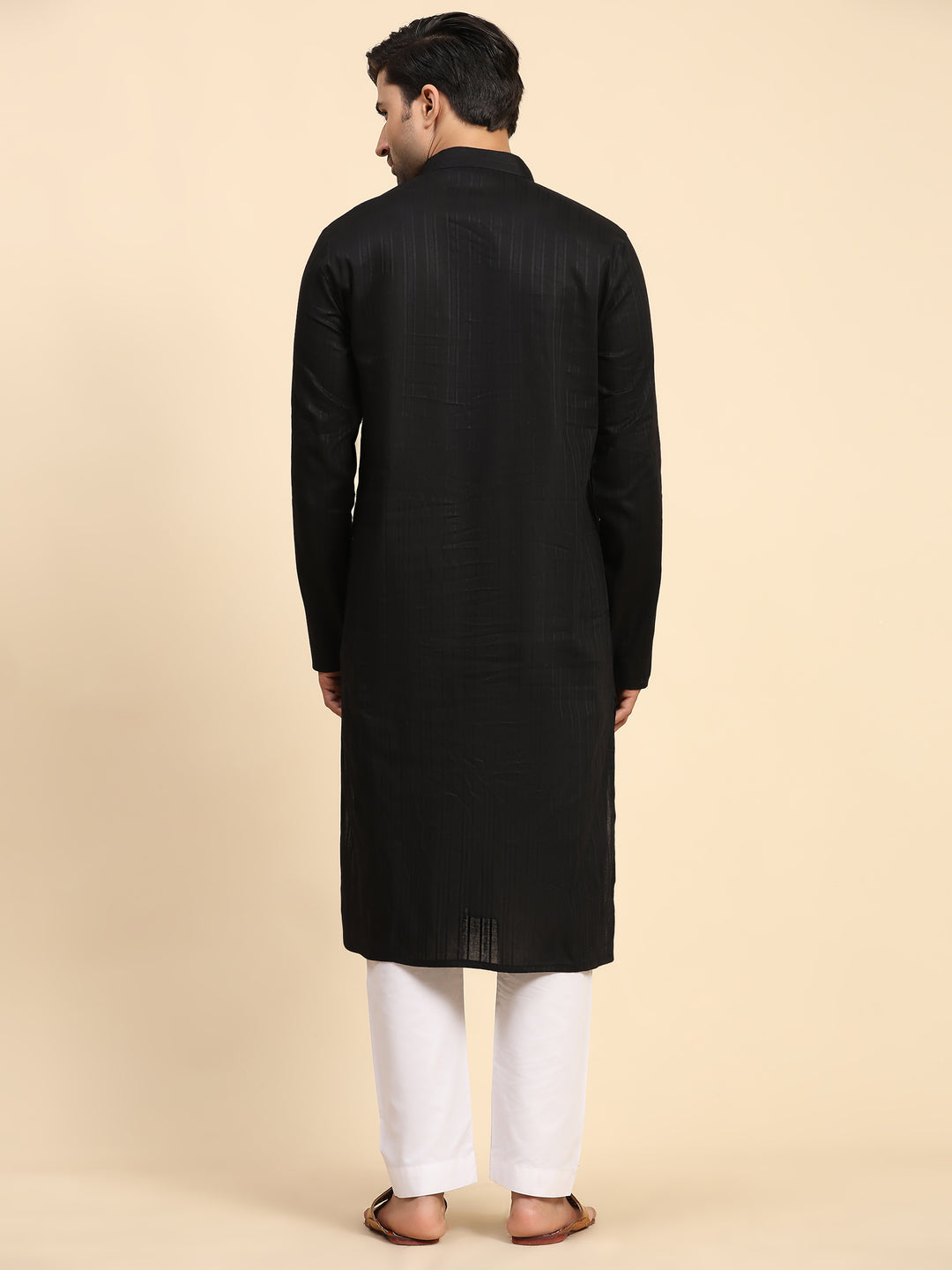 Traditional black kurta pajama for men featuring intricate handwoven embroidery on pure cotton fabric, paired with an art silk pajama.