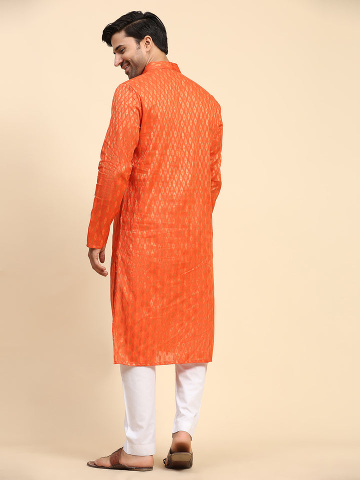 Premium orange kurta set for men crafted from pure cotton with cream art silk pajama for celebrations.