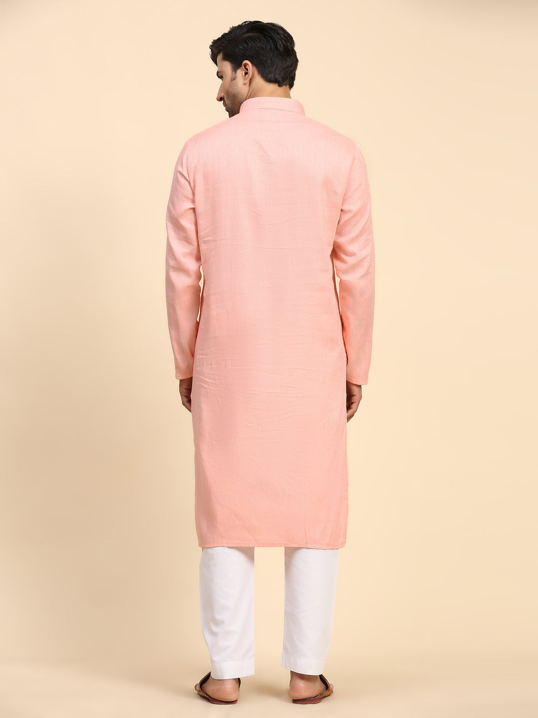 Elegant baby pink kurta set with full-weaved motifs, perfect for festive occasions.