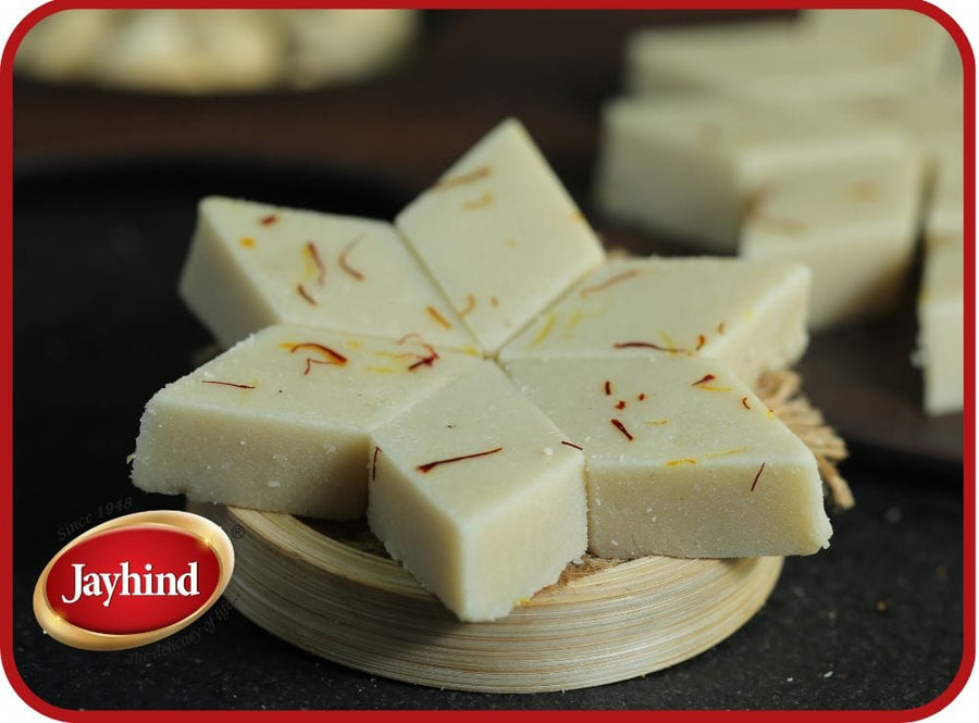 Badam Katli made with finely ground almonds, sugar, and aromatic cardamom, offering a rich and luxurious taste.