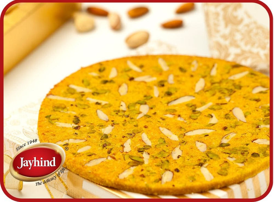 Badam Rotla made with almonds, jaggery, and aromatic spices – a delicious, nutty, and sweet traditional Indian treat.