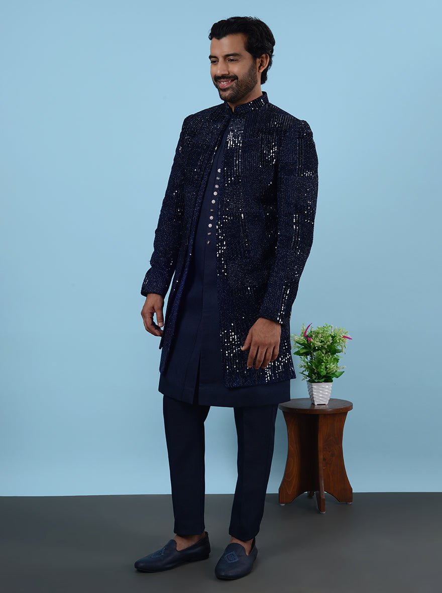 Experience elegance with this Navy Blue Indowestern, featuring Silk Blend and Velvet, perfect for upscale events in the USA, with intricate Resham and tar sequins work.