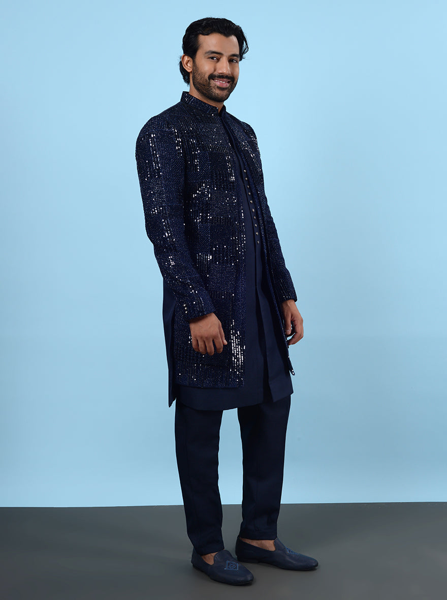 Step into luxury with this Navy Blue Indowestern made from Silk Blend and Velvet, ideal for stylish events in the USA, adorned with exquisite Resham and tar sequins work.