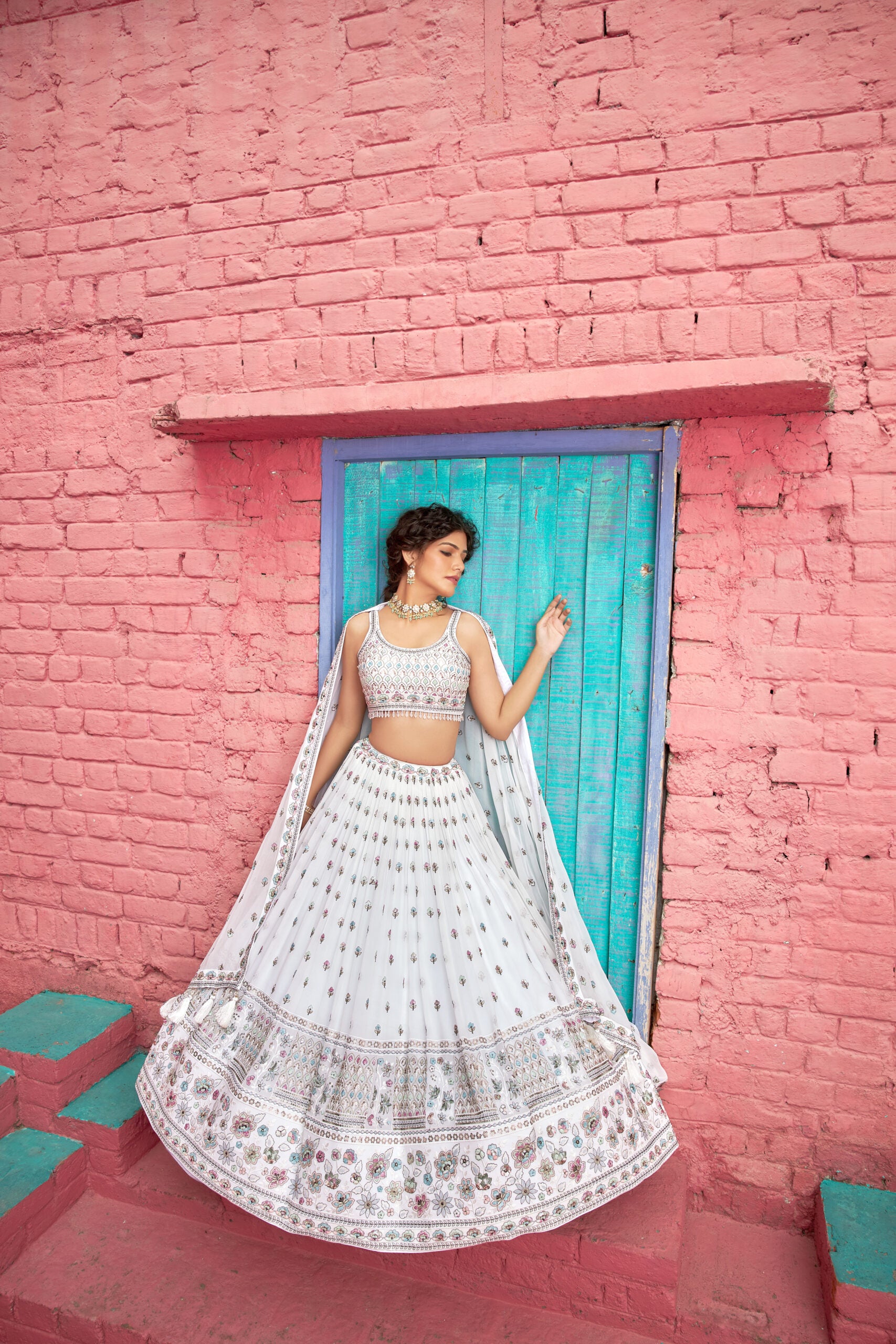 Elegant white lehenga choli set with stunning embroidery, perfect for brides seeking a designer touch for their wedding.