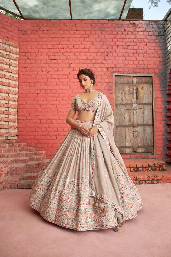 Stunning beige lehenga set with embroidered sequins and matching designer dupatta