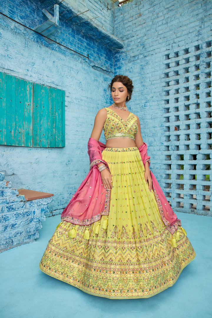 Bright yellow georgette lehenga set featuring sequins embroidery, complemented by a matching dupatta for a radiant look.