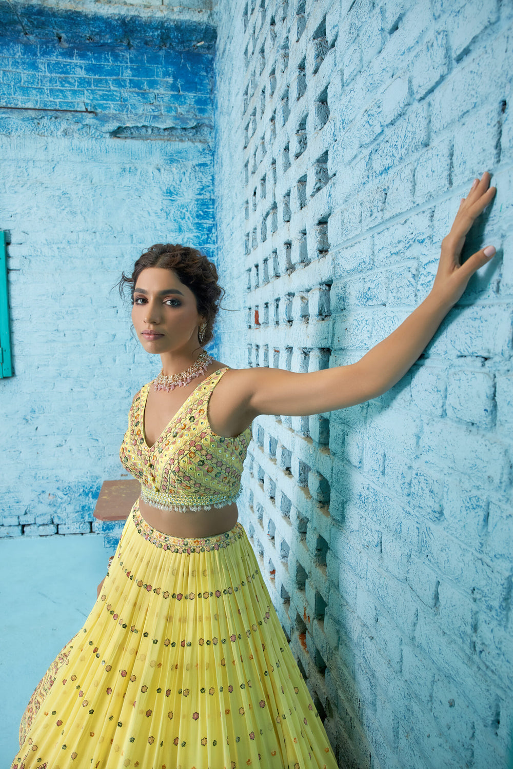 Chic radiant yellow lehenga with intricate sequins embroidery and a coordinating dupatta, ideal for festive occasions.