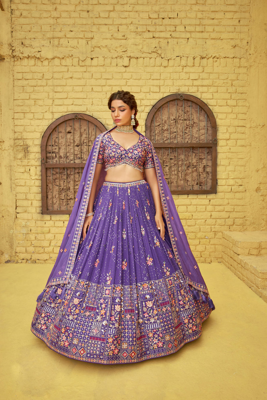 Elegant purple georgette lehenga set with sequins embroidery, complemented by a matching dupatta for a stunning look.