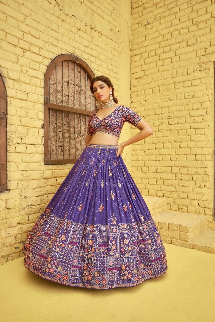 Purple lehenga set in georgette fabric adorned with sequins embroidery, paired with a graceful dupatta for a festive outfit.