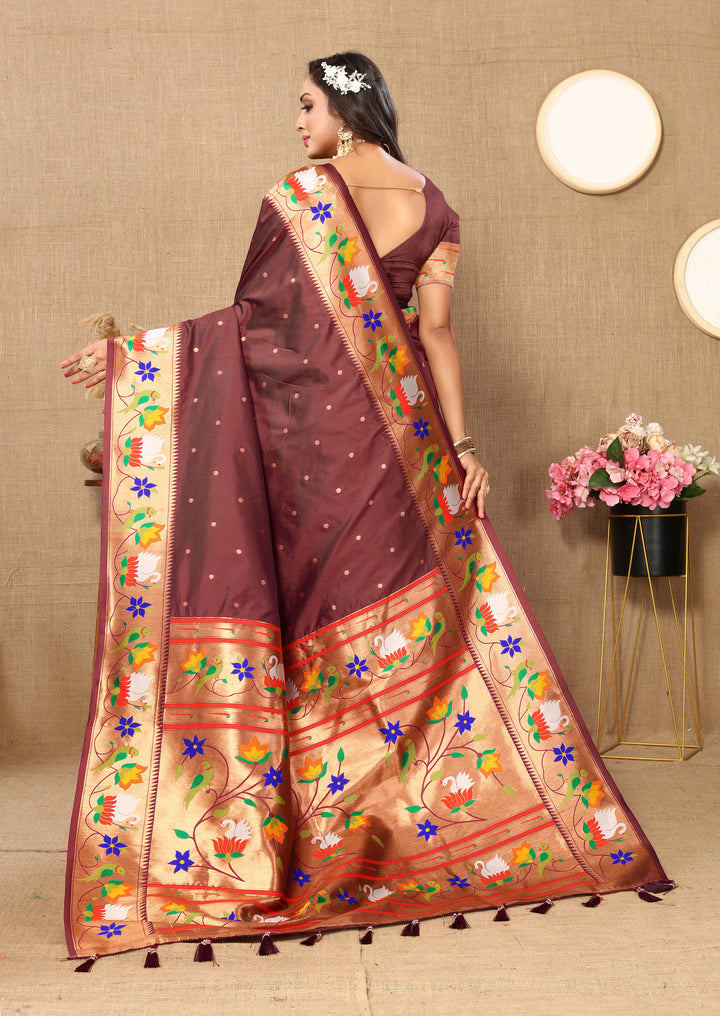 Purple Paithani silk saree, intricate meenakari work, zari border.