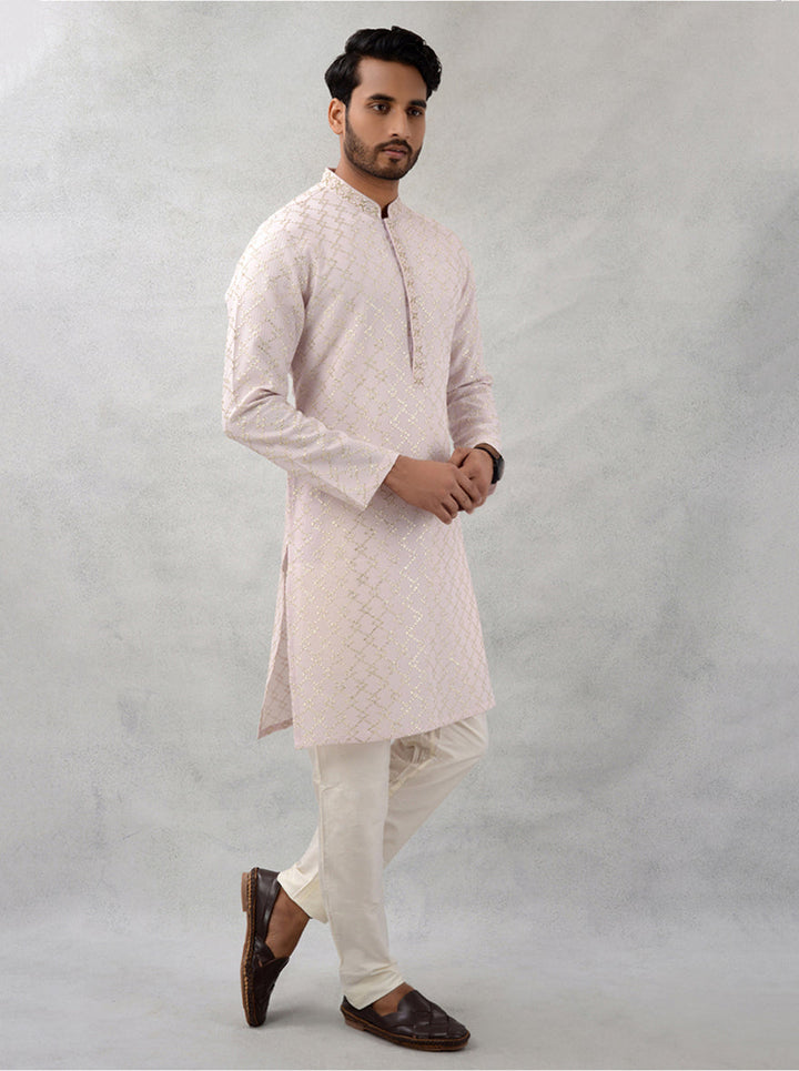 Designer peach kurta for cultural celebrations.