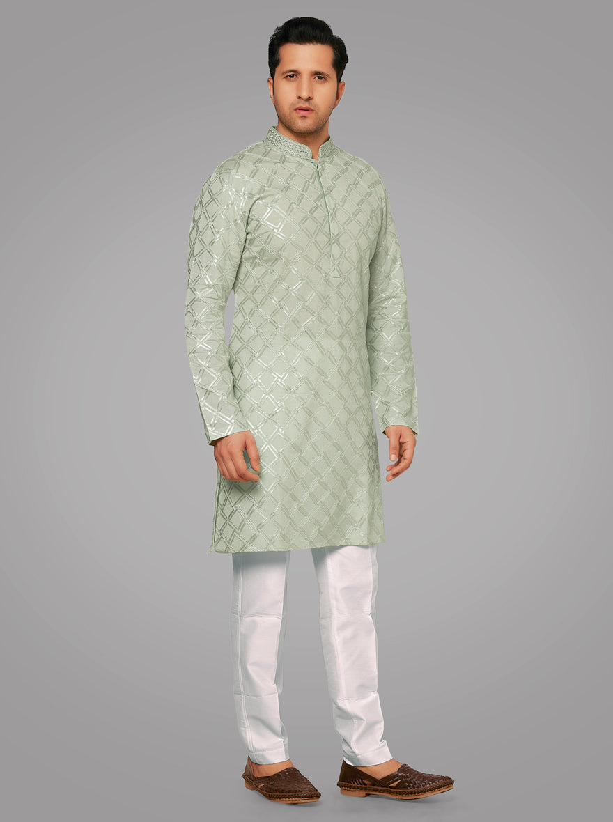 Pista-Green Kurta Pajama Set for men, with intricate embroidery for weddings.