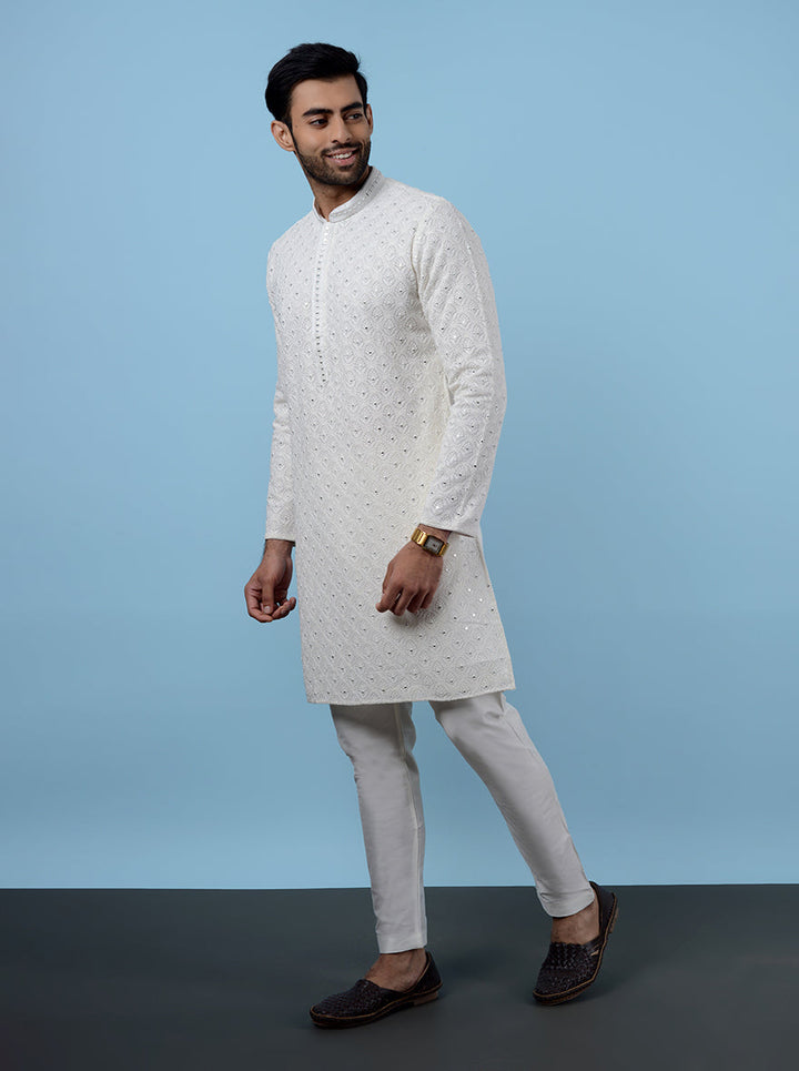 Celebrate in style with our cream kurta pajama, perfect for weddings and gatherings.