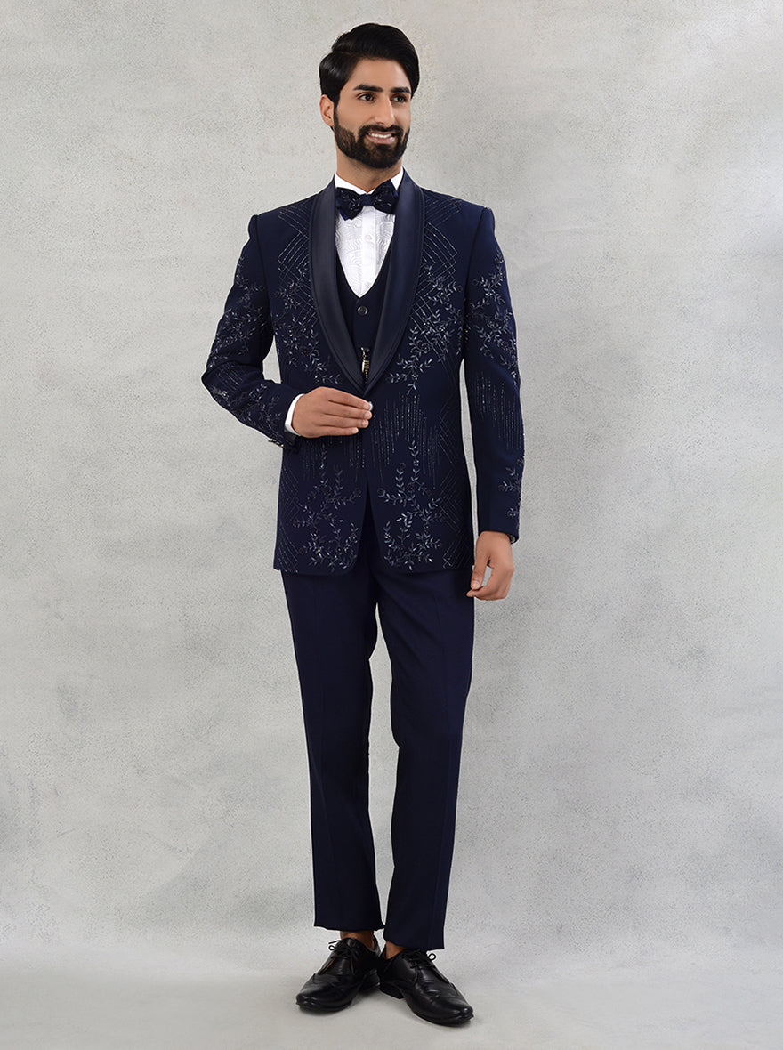 Blue suit with embroidered details, ideal for sangeet and reception events, combining style and sophistication.