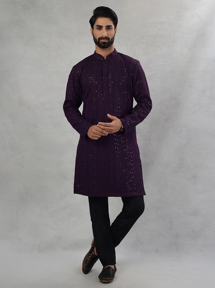 This traditional wine kurta pajama combines luxury with comfort, ideal for impressing at gatherings.