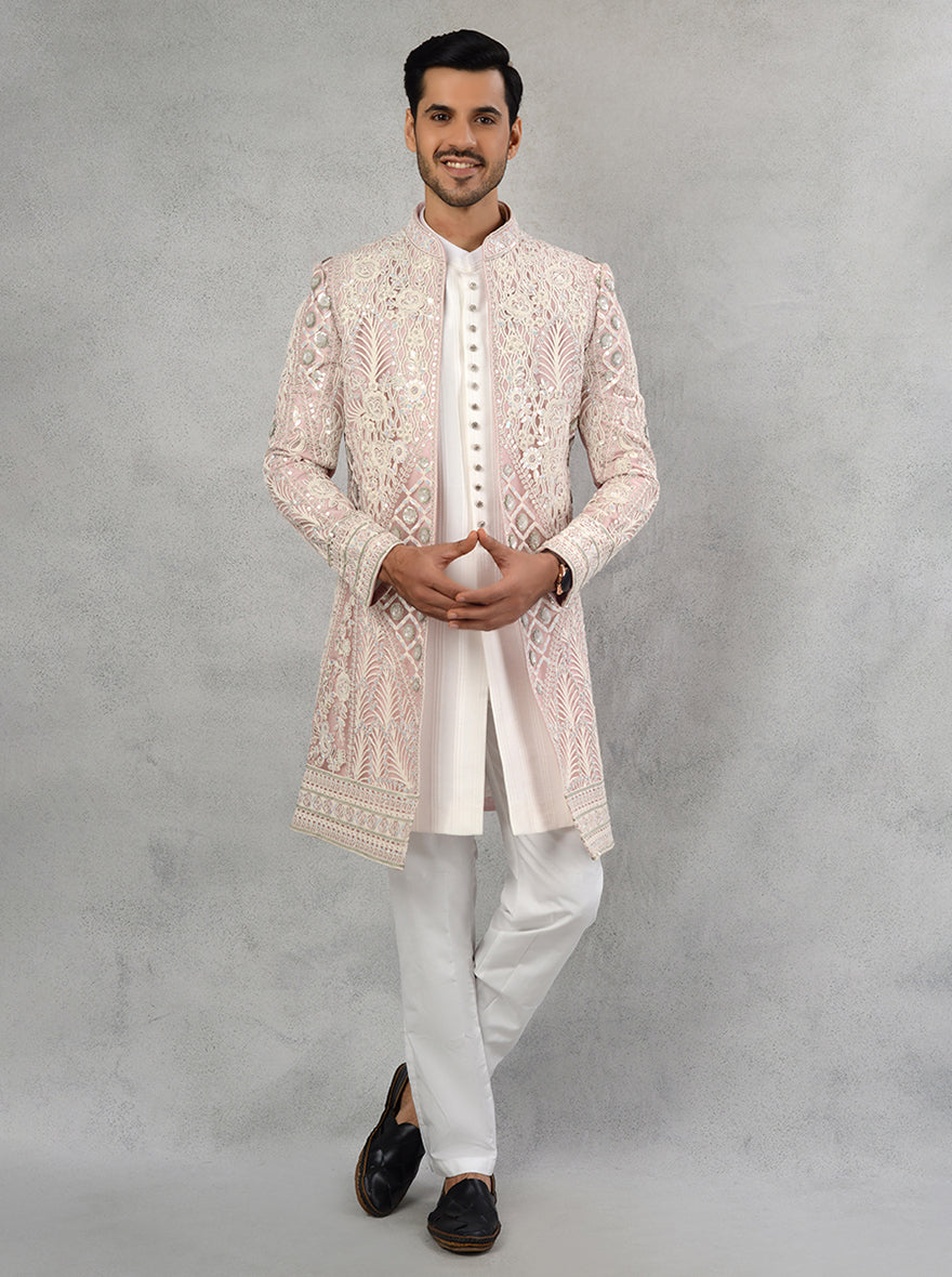 The cream and pink Indowestern outfit, with its exquisite embroidery and flattering silhouette, is perfect for celebrating sangeet and engagement ceremonies in the USA.