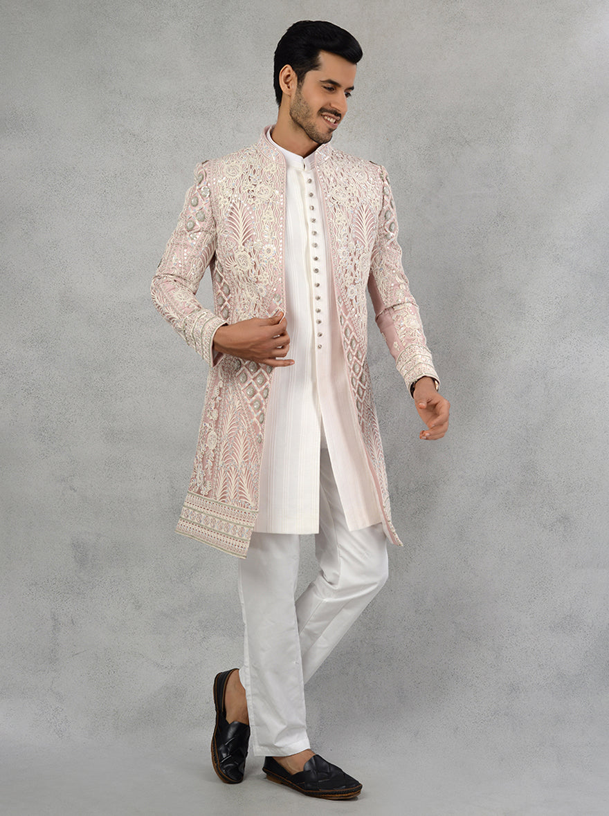 This charming cream and pink Indowestern outfit is designed for the USA's festive scene, perfect for sangeet and engagement celebrations with its beautiful embroidery.