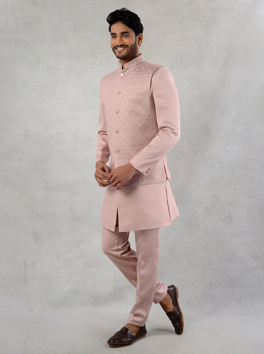 Step into sophistication with this embroidered onion pink kurta set, designed for festive events.