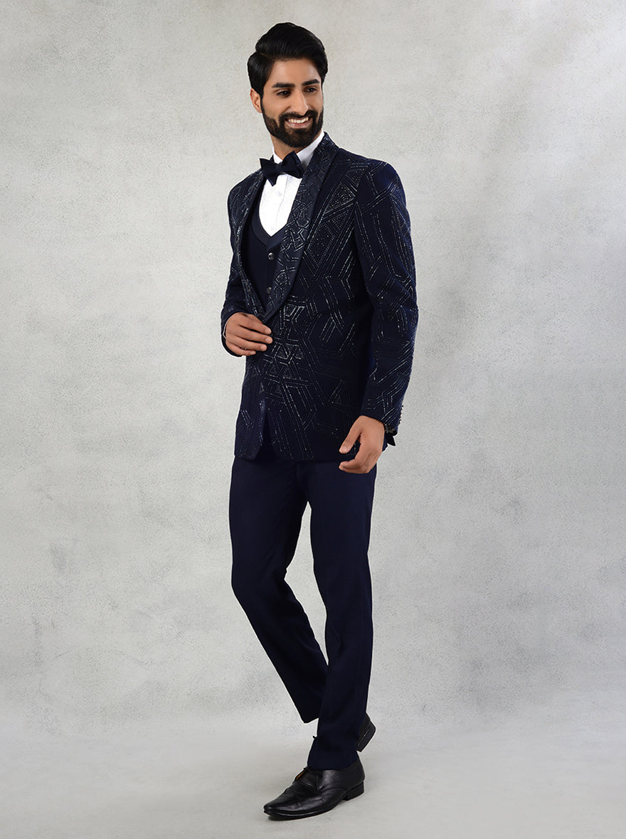 Designer blue embroidered suit featuring a classic shawl lapel, tailored for musical nights and reception events.