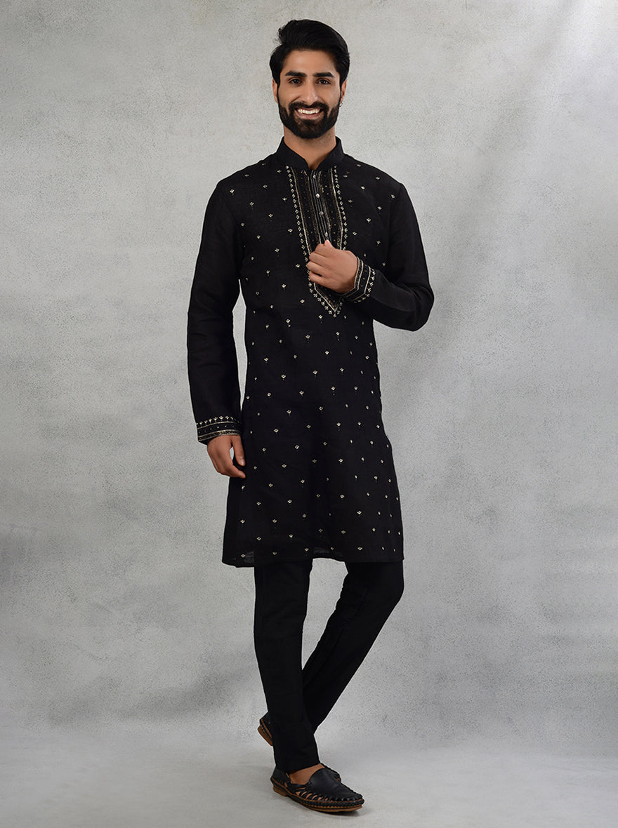 Stylish black kurta pajama featuring detailed embroidery, ideal for making a fashionable impression.