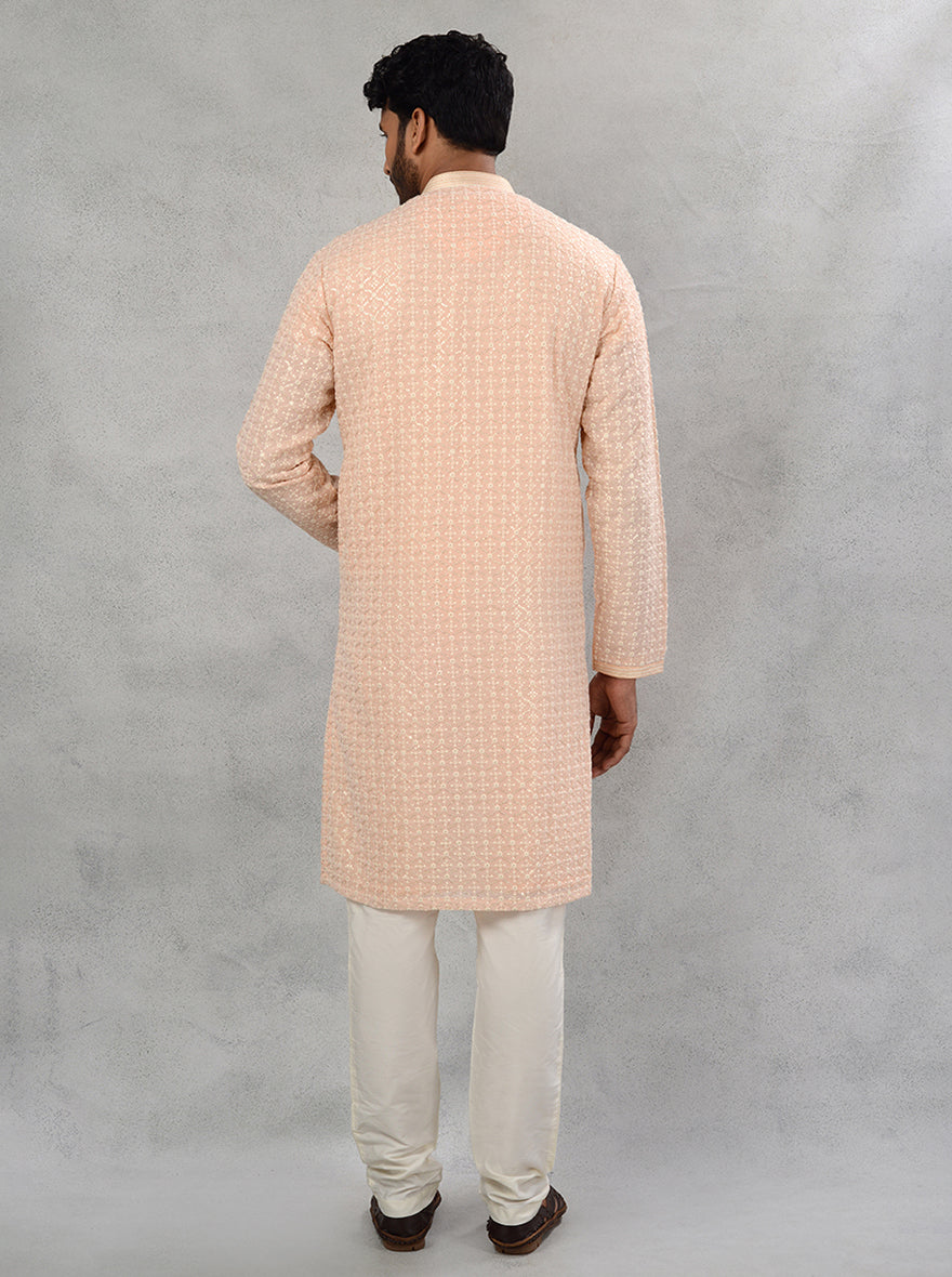 Stylish peach kurta pajama featuring exquisite embroidery, designed for modern celebrations in the USA.