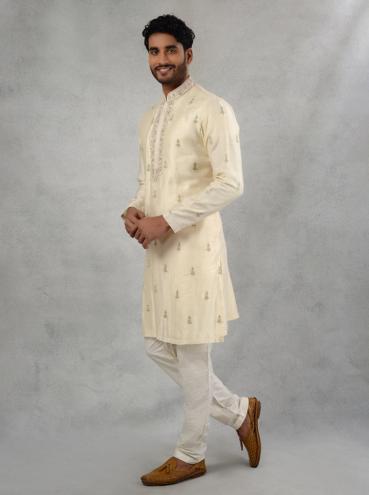 Celebrate in style with this sophisticated ivory kurta pajama for festive occasions.