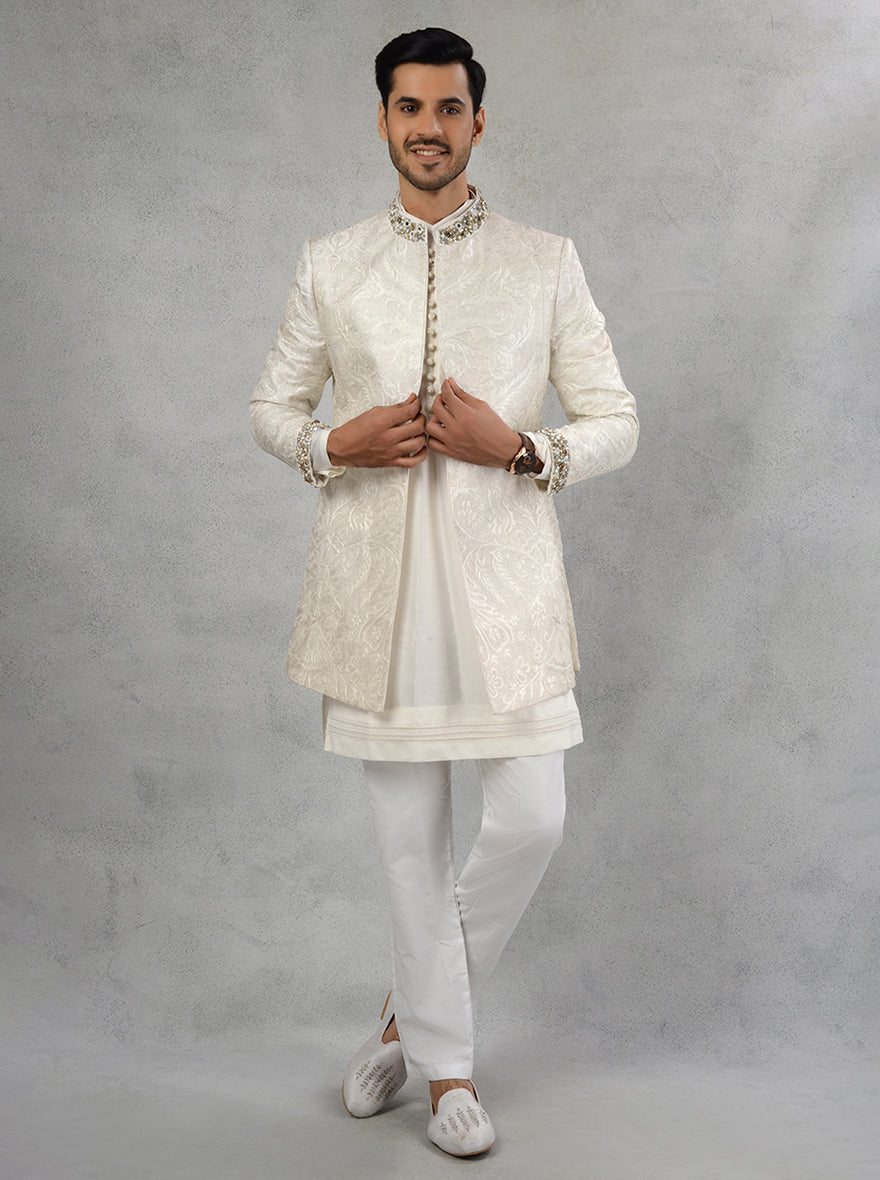 Experience luxury with our Off-White Indo Western attire, featuring intricate Kasab work for modern charm.