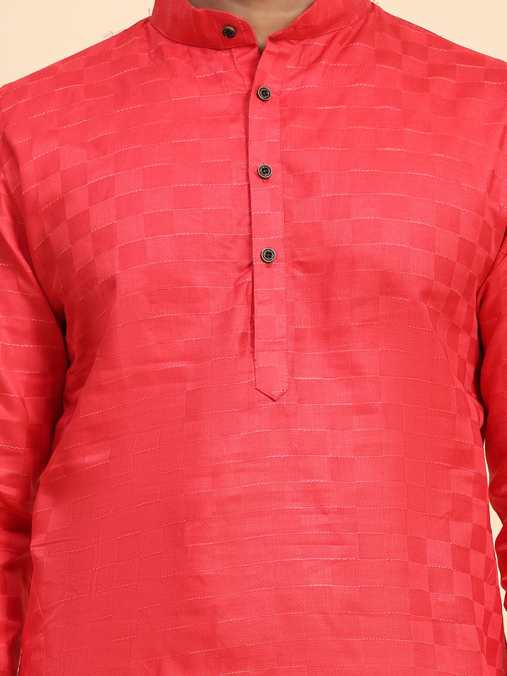 Elegant red kurta for men, paired with cream silk pajama for a festive look.