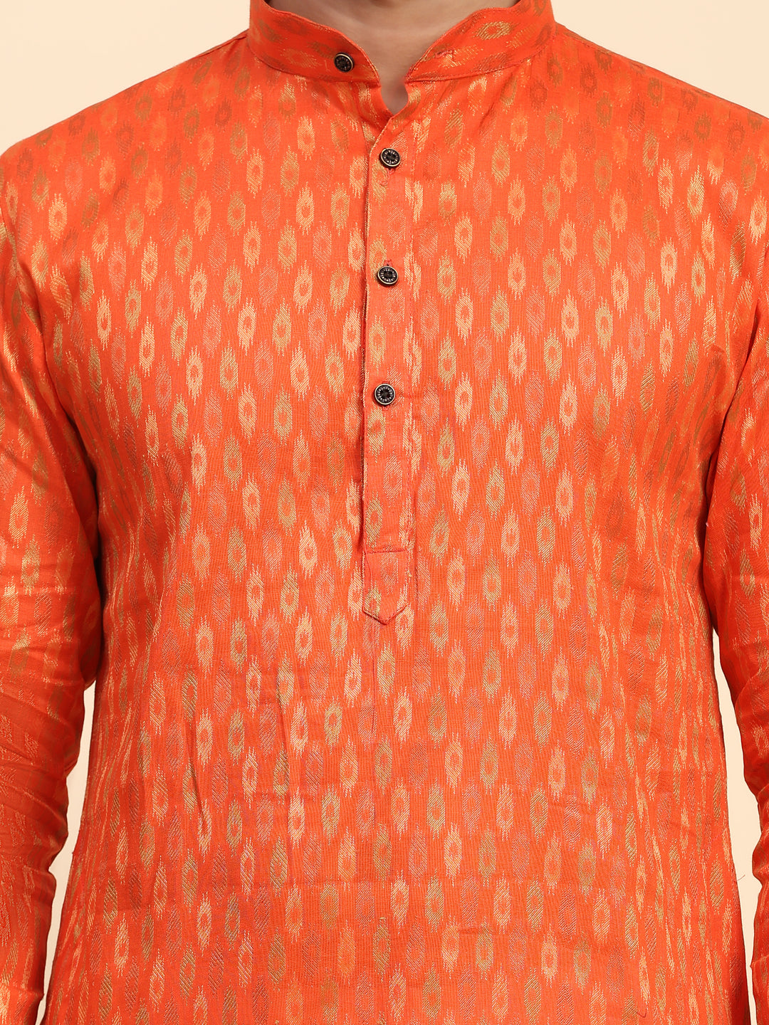 Bhagva orange kurta set for men with embroidered motifs and cream art silk pajama.