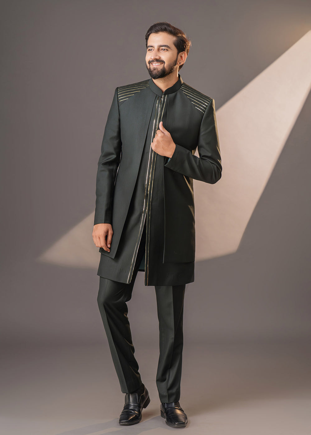 Elevate your look at celebrations with this stylish dark green layered kurta, designed for modern gentlemen.