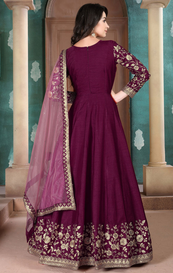 Elegant wine salwar kameez featuring a timeless silhouette and exquisite craftsmanship, perfect for enhancing your wedding wardrobe.