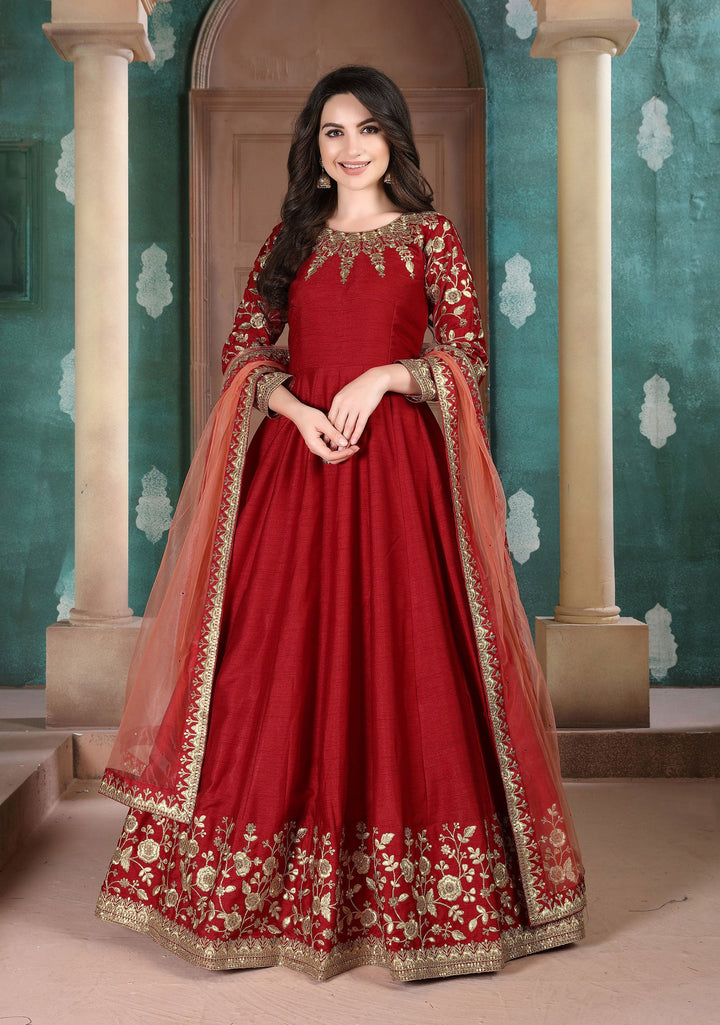 Bold red party wear salwar kameez, perfect for festive gatherings, featuring elegant embroidery and striking design.