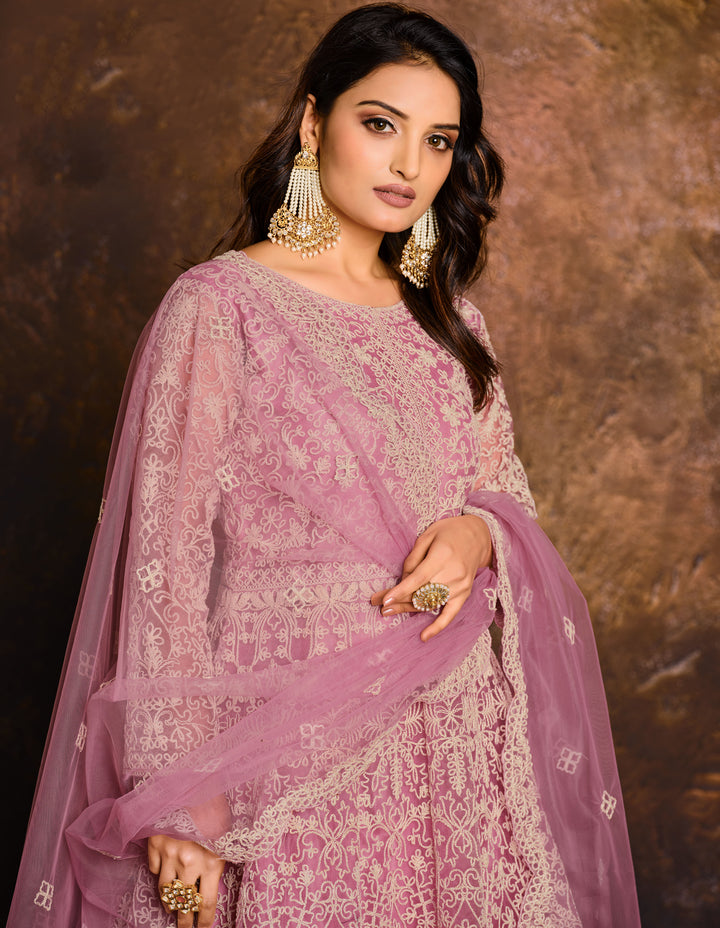 Chic pink salwar kameez showcasing exquisite craftsmanship, designed for modern women celebrating special events in the USA.