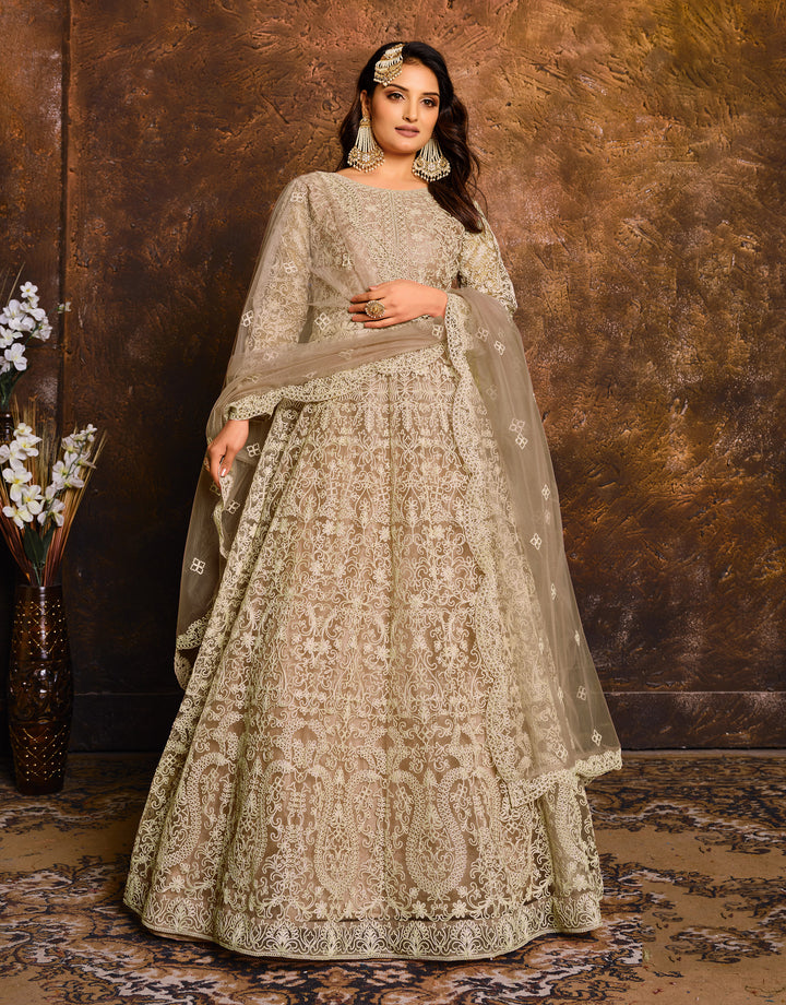 Timeless beige traditional salwar kameez, perfect for gatherings, featuring elegant design and intricate detailing.