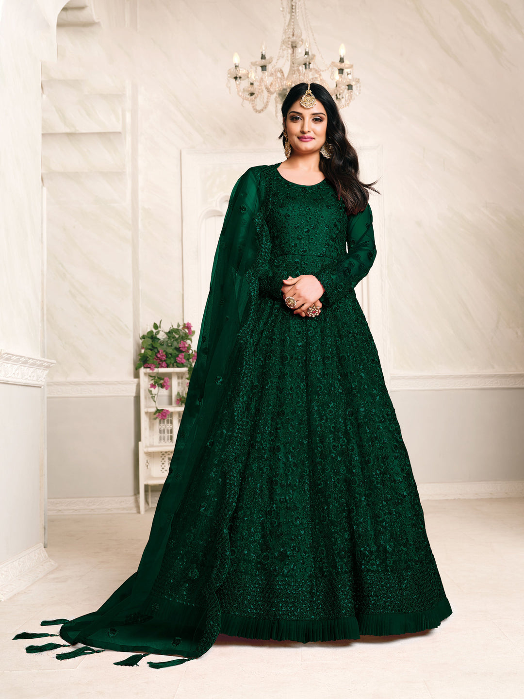 Rich dark green salwar suits, perfect for festivities, featuring traditional design and elegant embroidery.