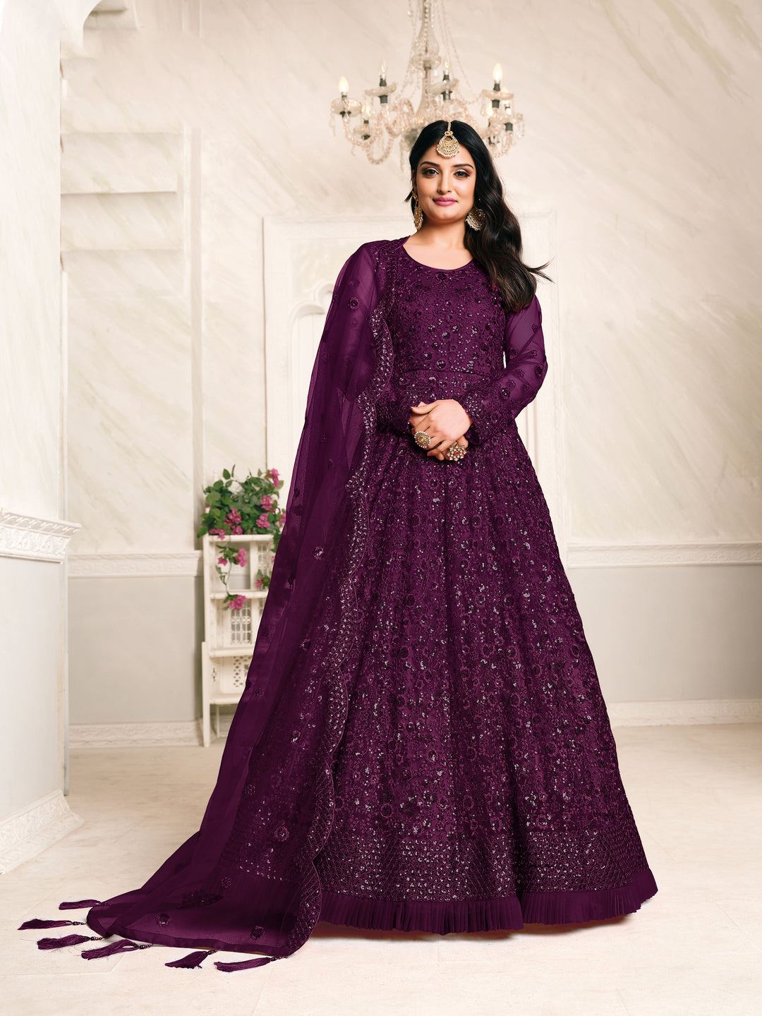 Luxurious dark purple Anarkali suit, perfect for gatherings, featuring exquisite embroidery and stylish design.