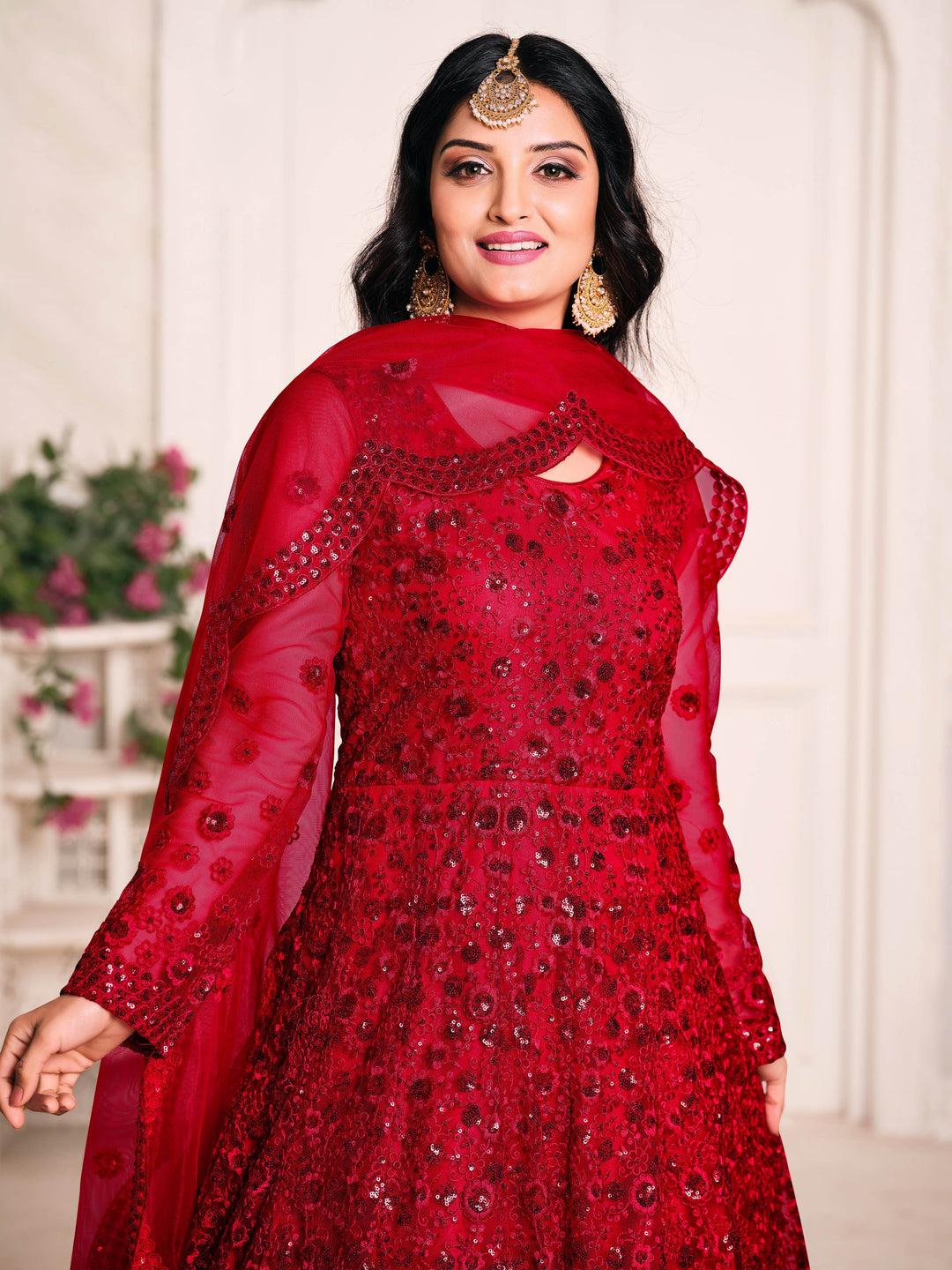 Beautifully crafted red cotton salwar kameez set, ideal for weddings and parties with elegant detailing and luxurious comfort.