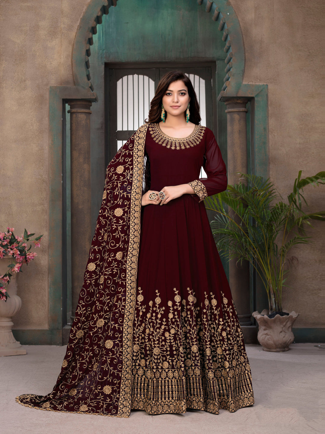 Dazzling red salwar kameez set, perfect for celebrations, featuring eye-catching design and exquisite detailing.