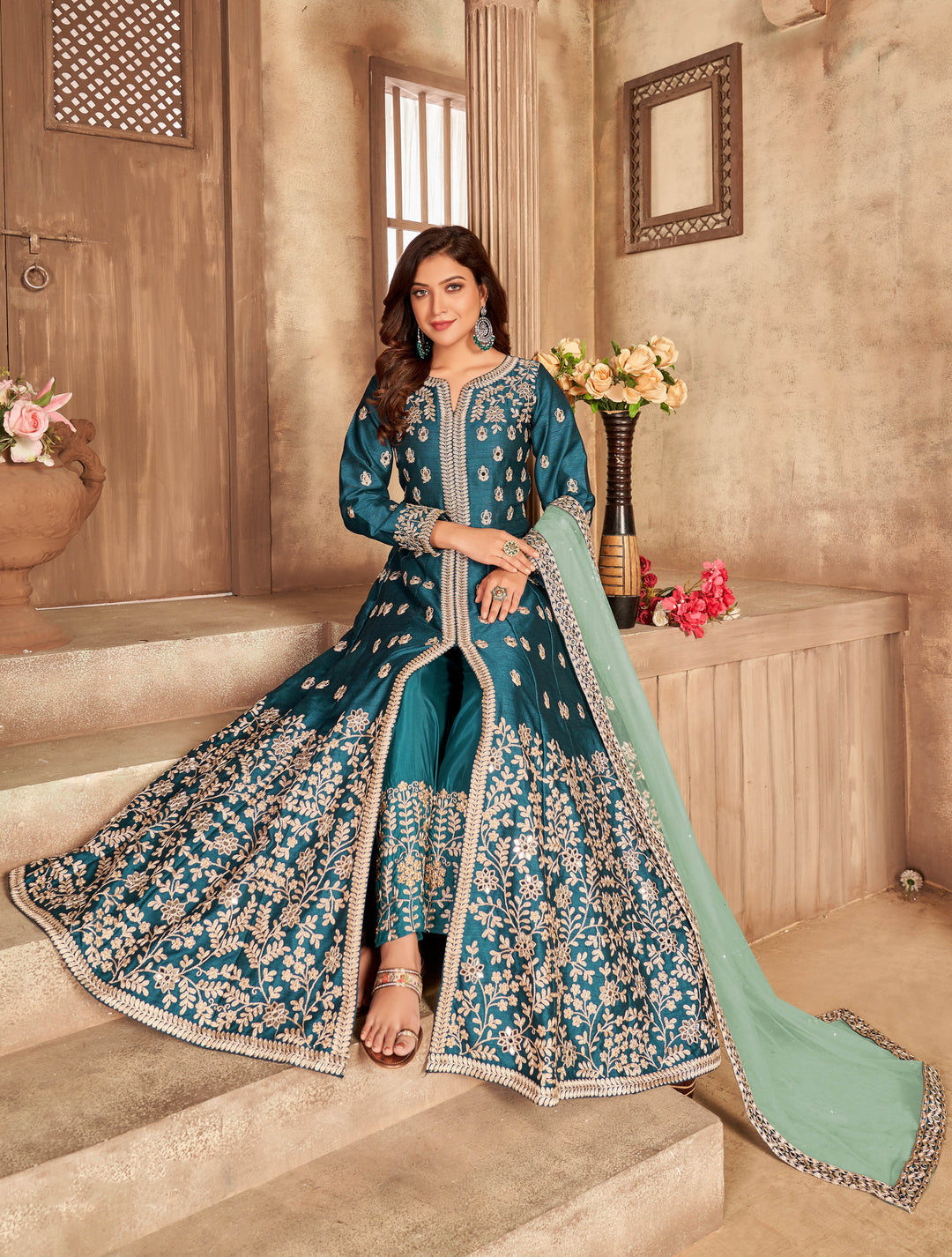 Stylish teal art silk salwar kameez, offering a perfect blend of tradition and comfort, ideal for special occasions.