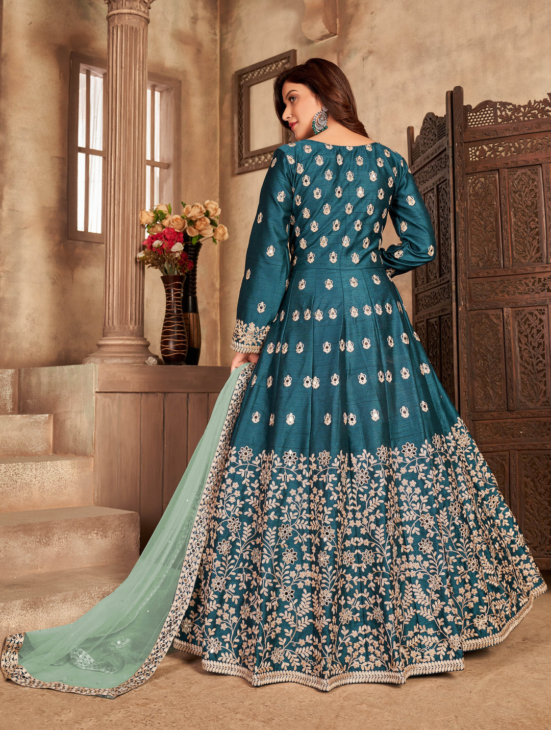 Chic teal salwar kameez showcasing elegant design, perfect for modern women celebrating cultural events in the USA.