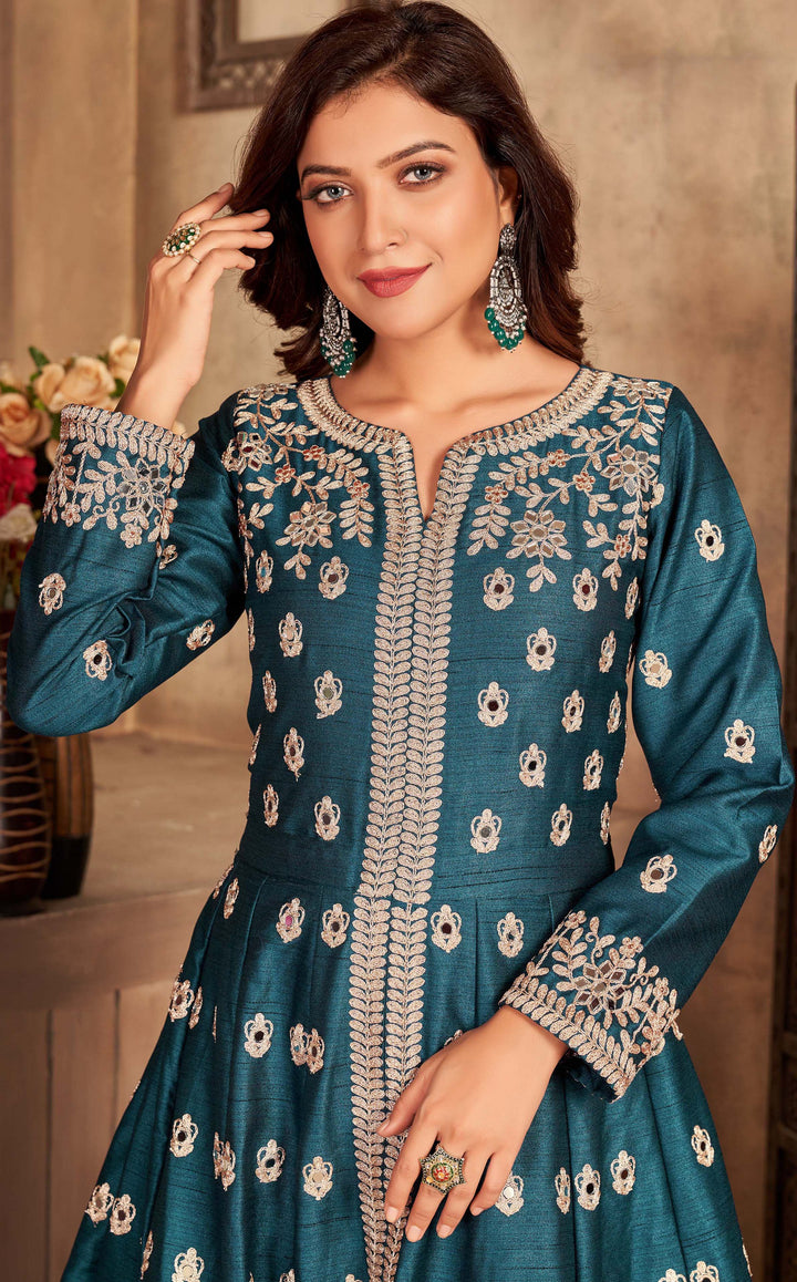 Beautifully crafted teal art silk salwar kameez, designed for festive gatherings with luxurious fabric and a stylish fit.