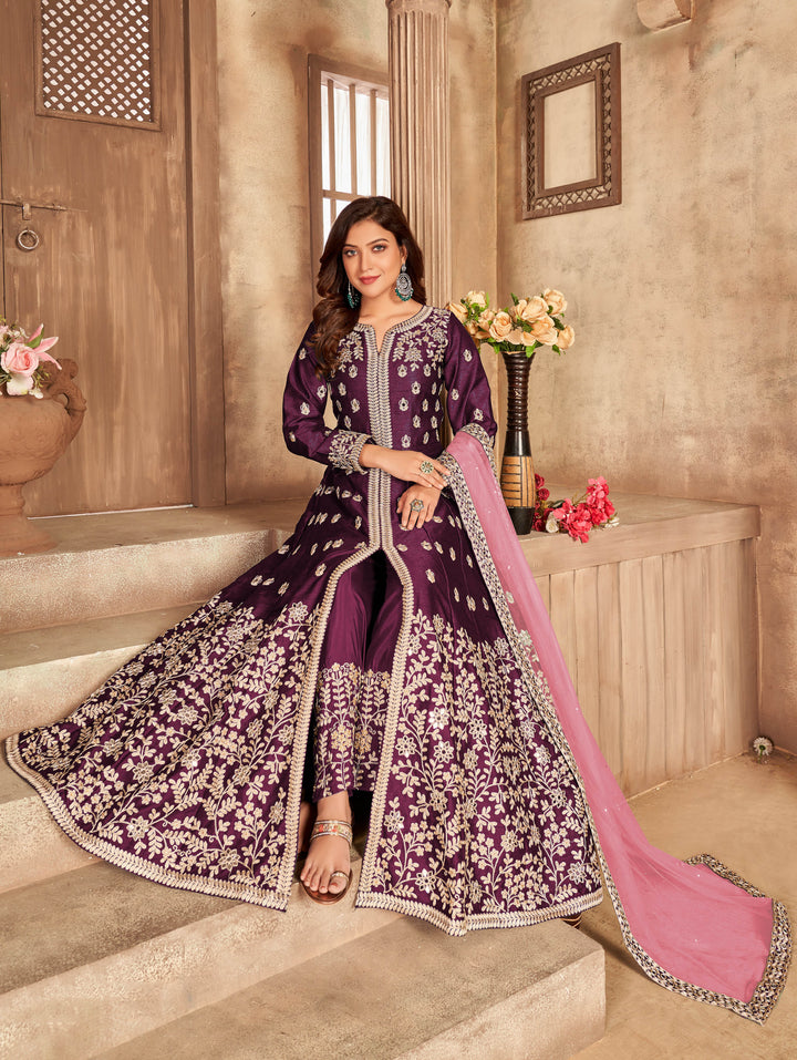 Sophisticated purple art silk salwar kameez, featuring intricate embroidery for a delightful ethnic look.