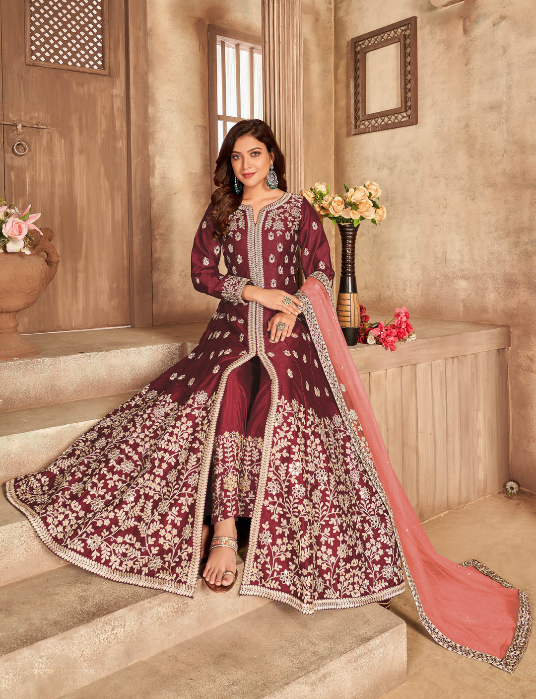 Luxurious maroon art silk salwar kameez, perfect for festive gatherings with elegant design and intricate detailing.