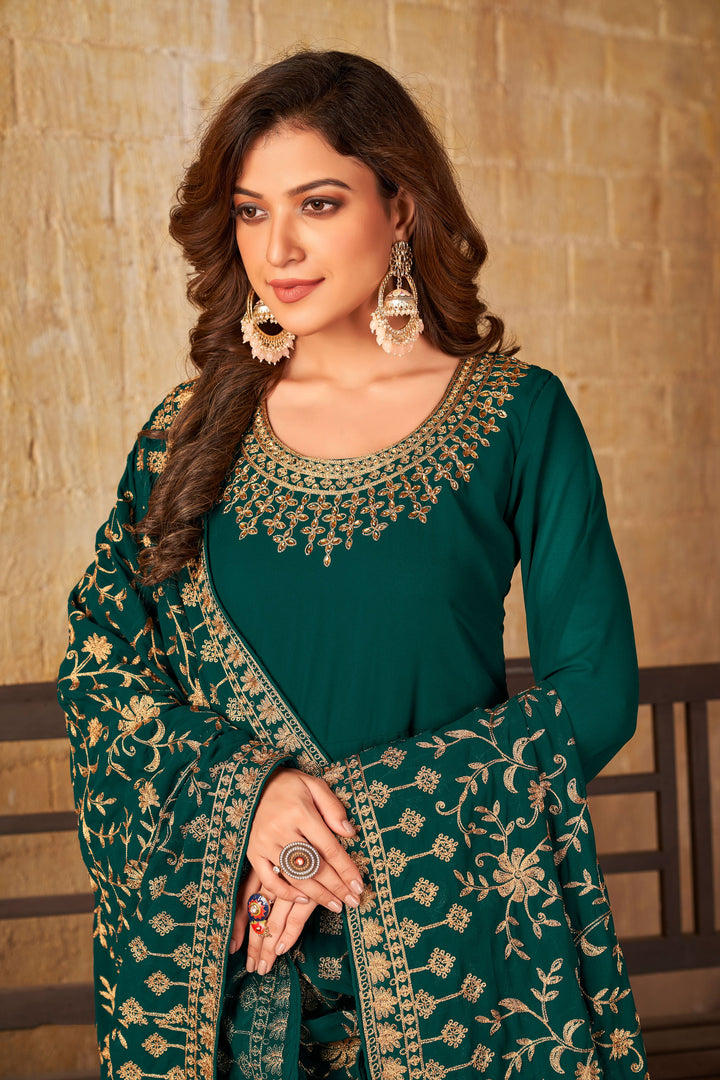 Chic teal green salwar kameez featuring exquisite detailing, designed for modern women celebrating special events in the USA.