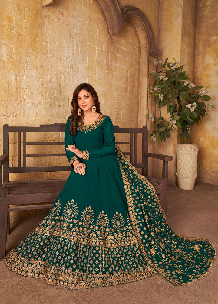 Beautiful faux georgette salwar kameez in teal green, ideal for weddings and gatherings with luxurious fabric and elegance.